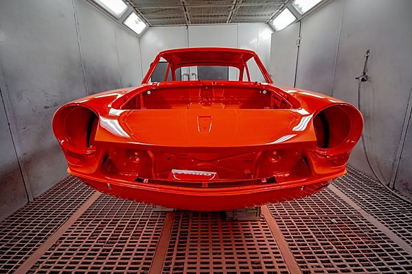 Vehicle inside a spray booth during paint work